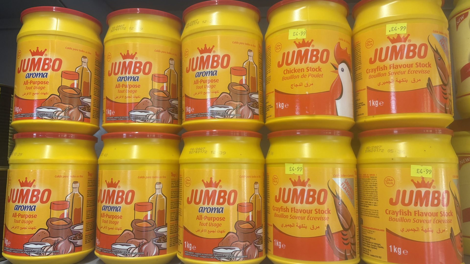 Rows of large Jumbo seasoning tubs on the shelves