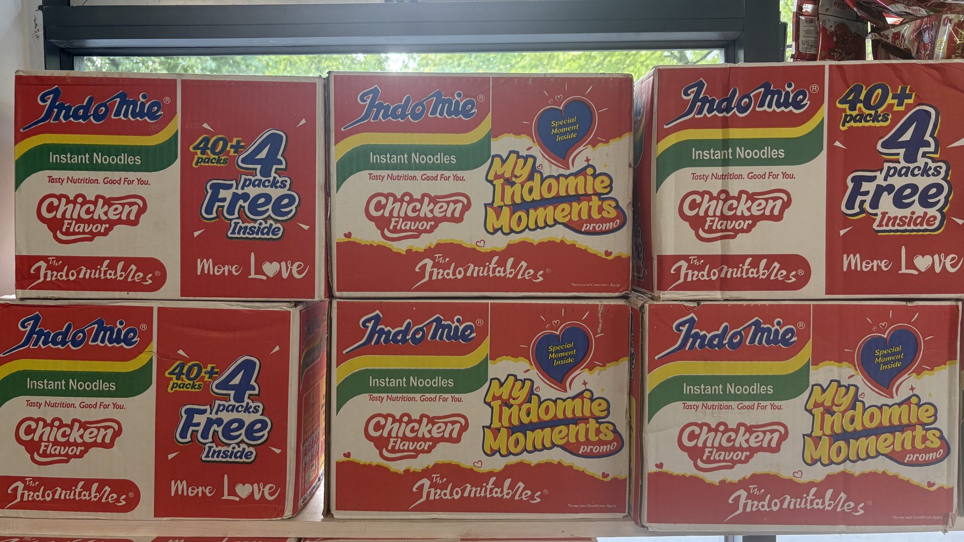 Stacked cartons of Indomie instant noodles