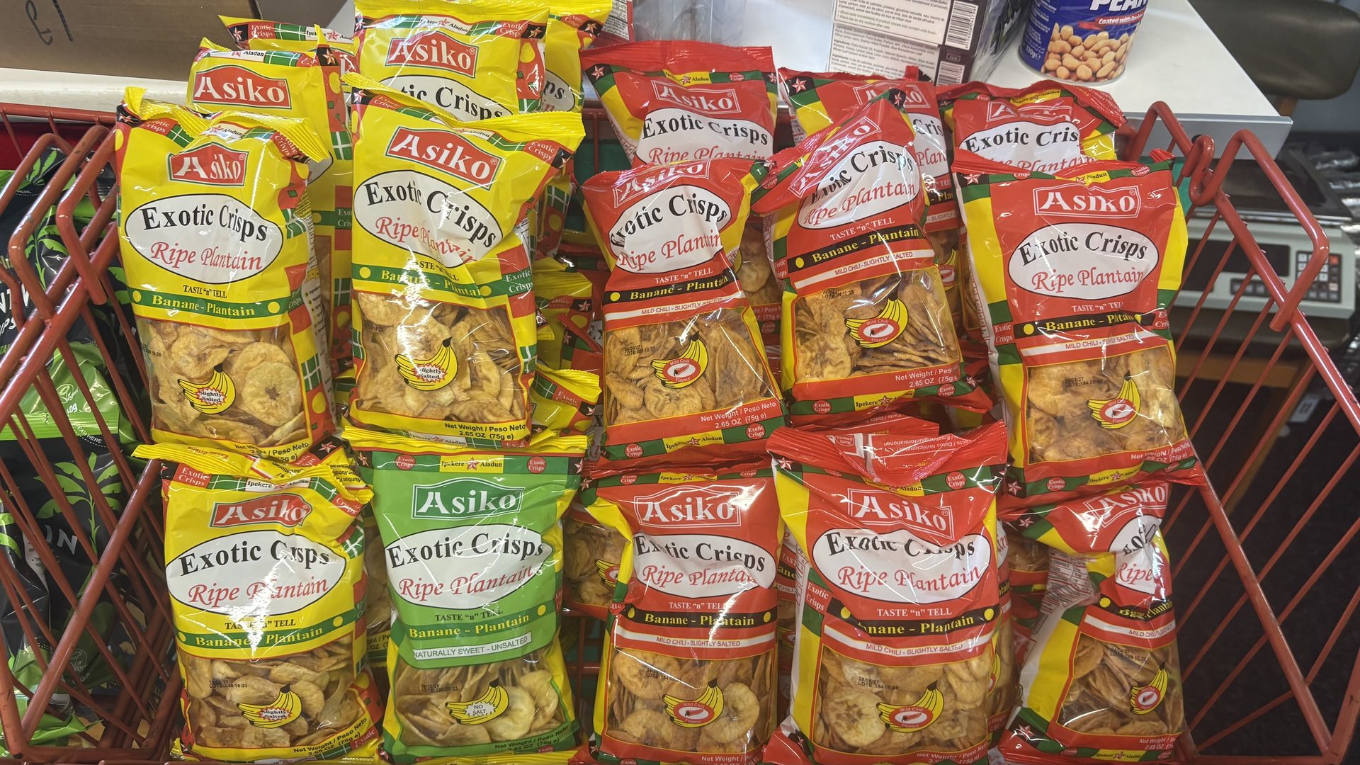 Shelves of Asiko exotic plantain crisps in bright yellow packets